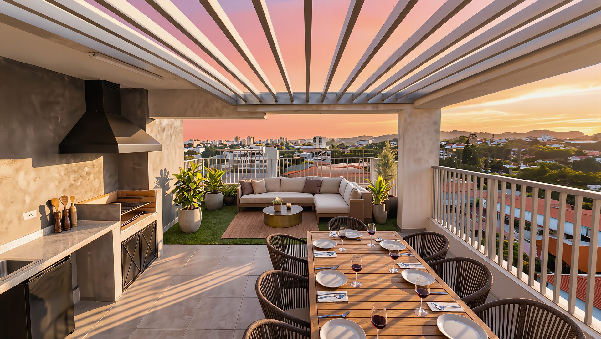 Quincho y mesa de comedor del Penthouse al atardecer, con la terraza y la vista a la ciudad al fondo